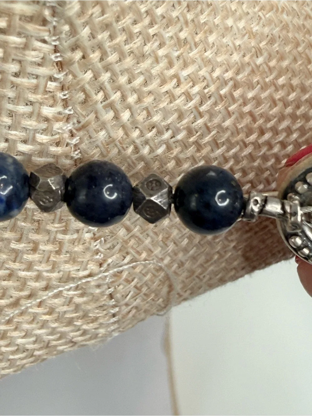 sterling silver necklace dark blue lapis lazuli beads geometric silver accents.